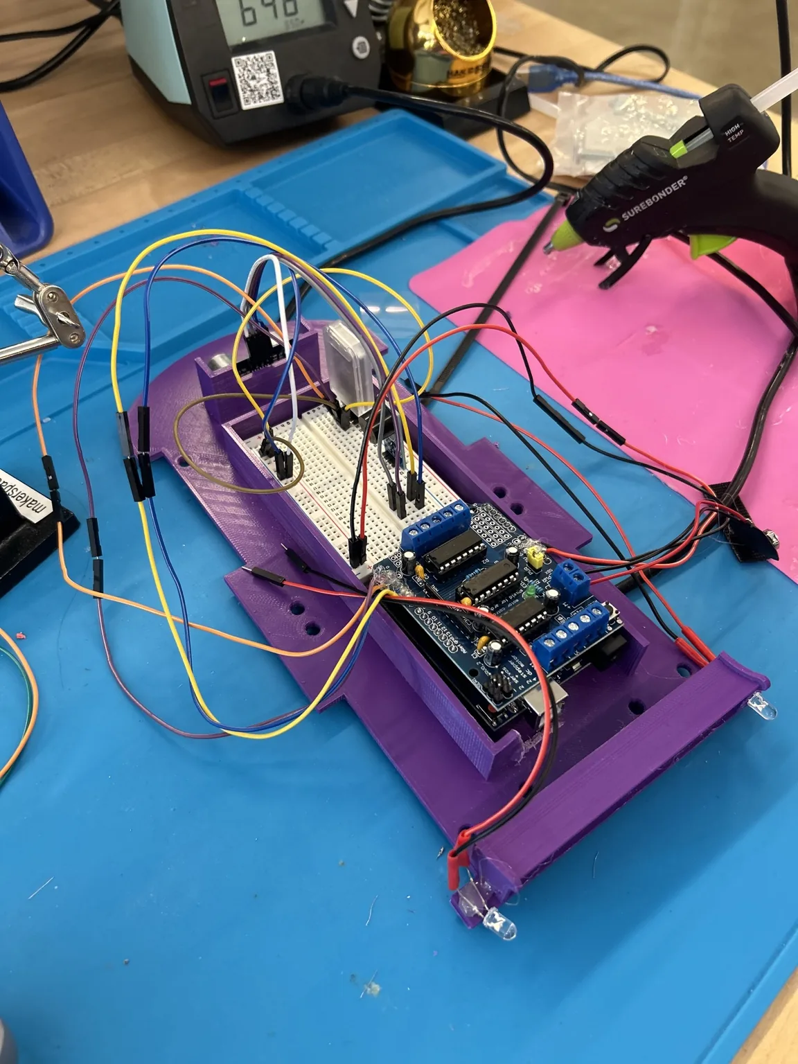 Circuit car electronics mounted in the purple chassis during assembly