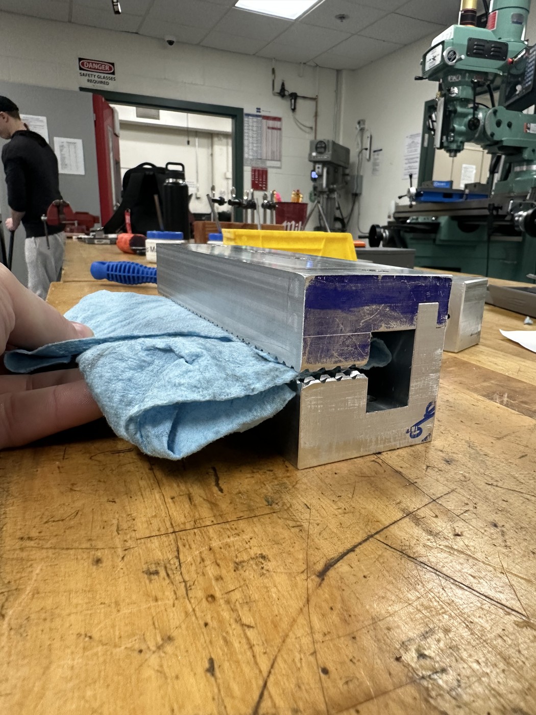 Original team prototype holding a cloth sample in the laboratory test fixture