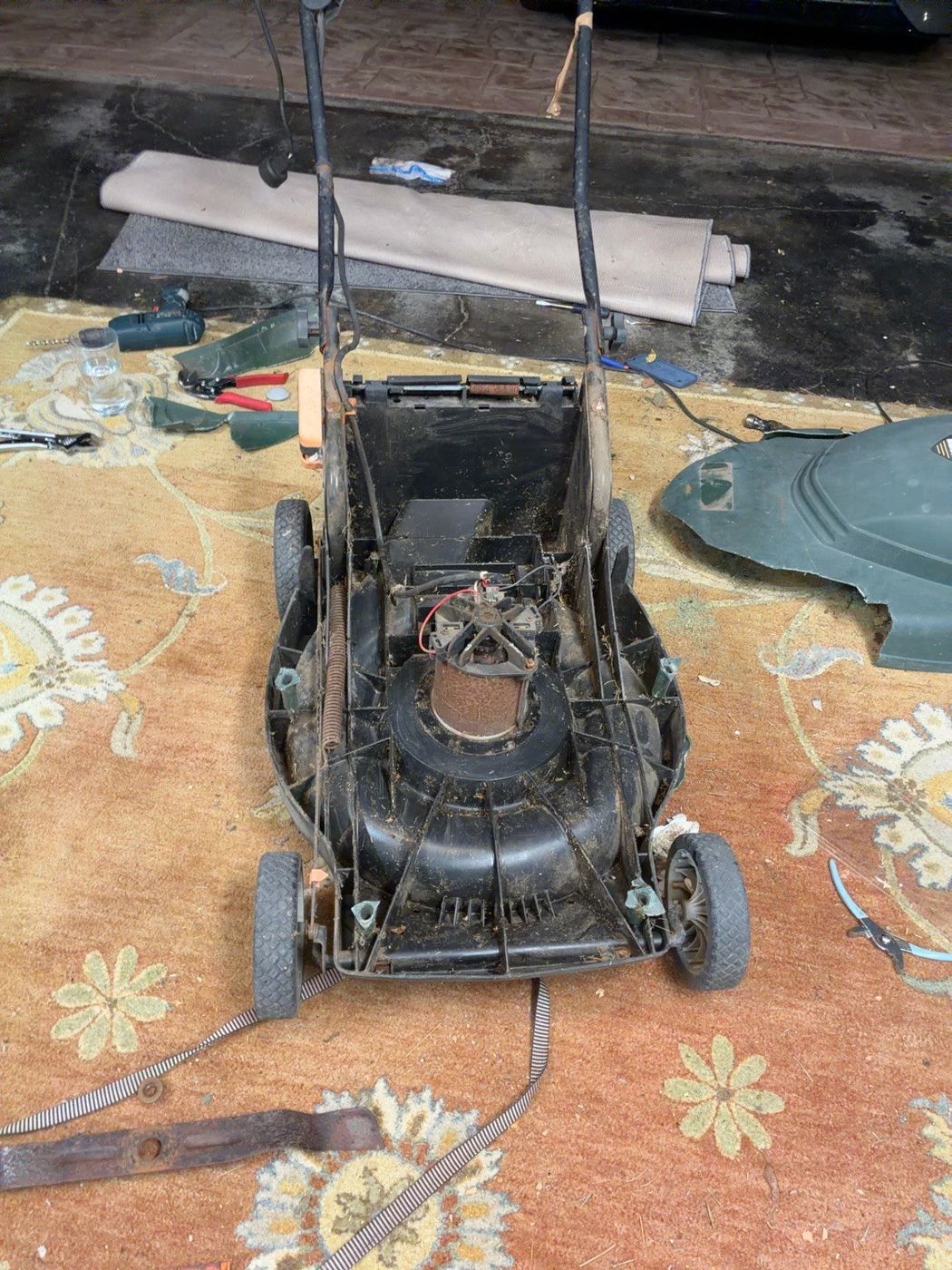 Front view of the mower with its handle upright and upper housing removed